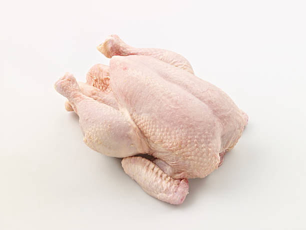 Raw whole chicken on white background فراخ كاملة 1100-1200جم / Chicken Whole (1100/1200 Kg) - Image 1